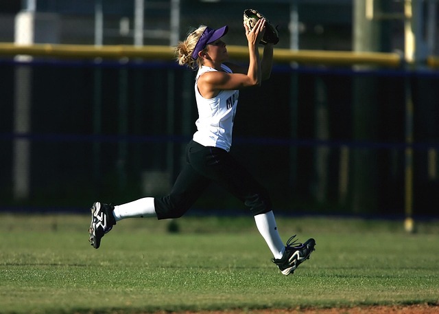 Fielding player making a spectacular catch, surrounded by vibrant light effects.